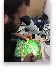 Tech working on TV Power supply board